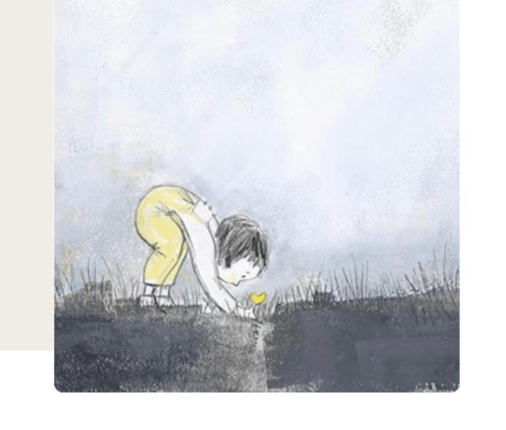 A child tending a small yellow flower